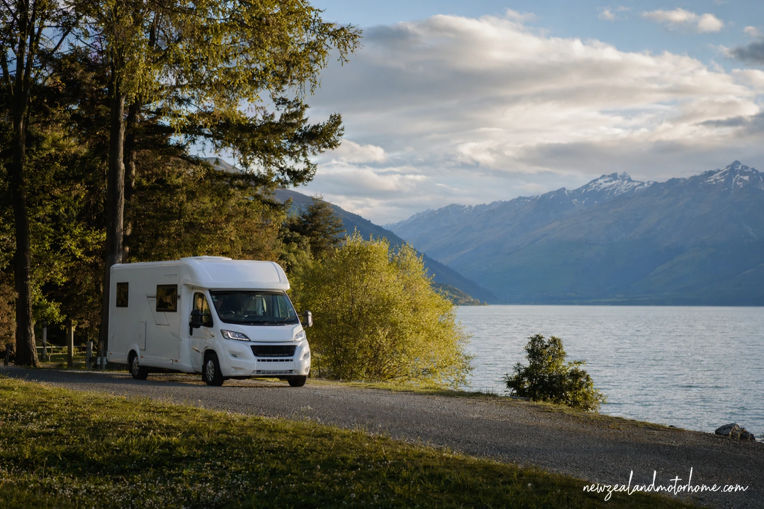 Campervan parked near Glenorchy with Lake Wakatipu and mountain peaks in the background