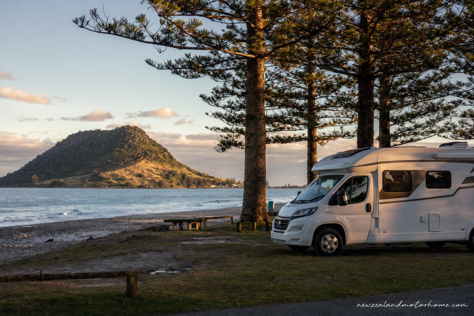 Campervan parked near Mount Maunganui with Mauao and the beach in the background