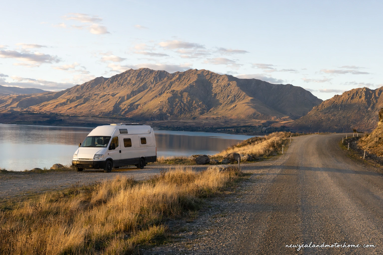 Campervan parked near Twizel with Lake Pukaki and the Mackenzie Basin mountains in the background