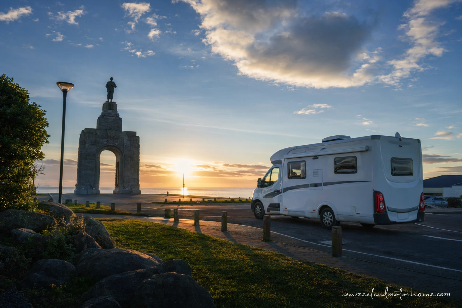 Campervan parked near Invercargill with open Southland road and coastal hills in the distance