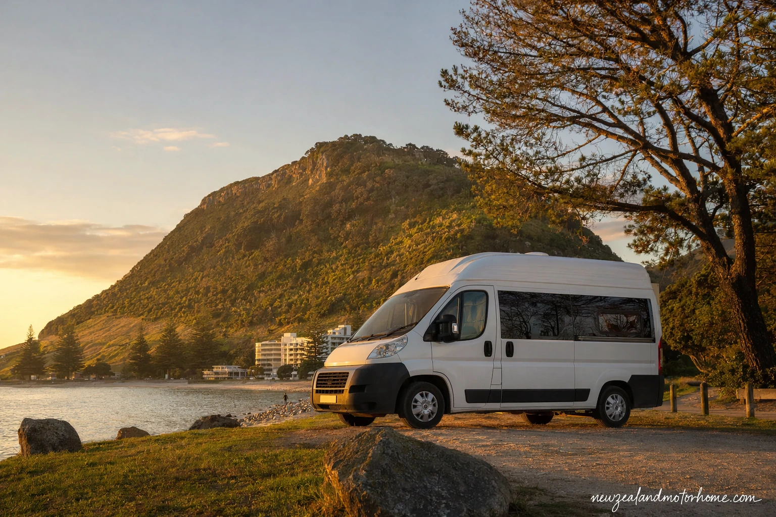 Campervan parked near Tauranga harbour with Mount Maunganui and the Bay of Plenty coast in the background