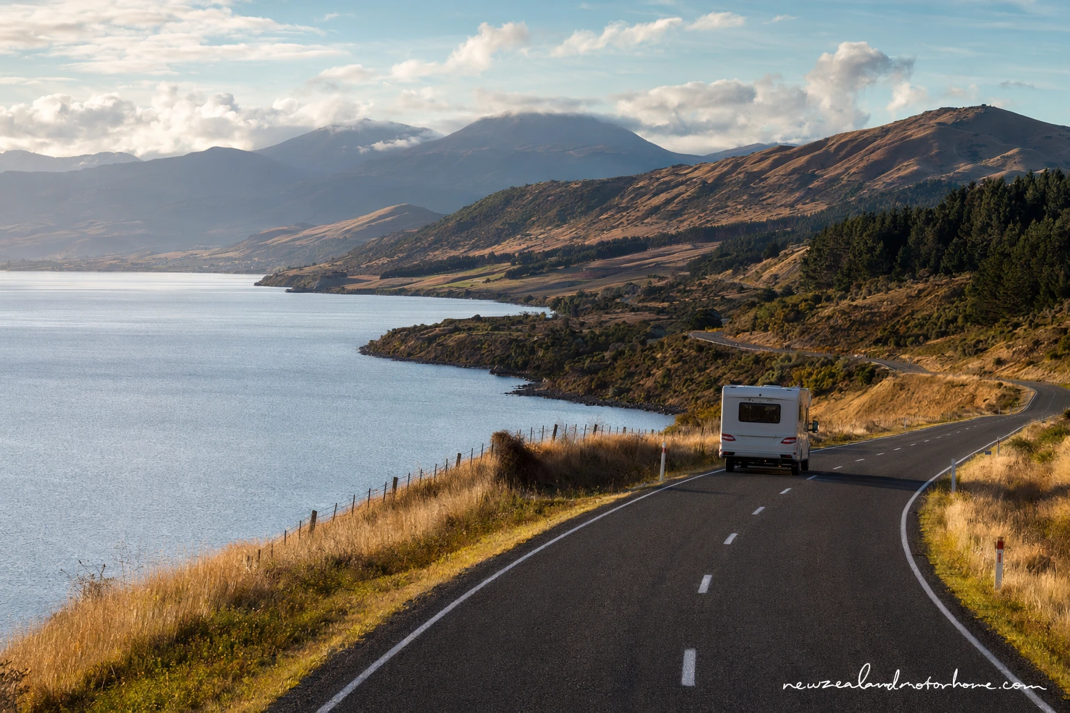 Campervan parked near the Tauranga waterfront after a long route from Dunedin