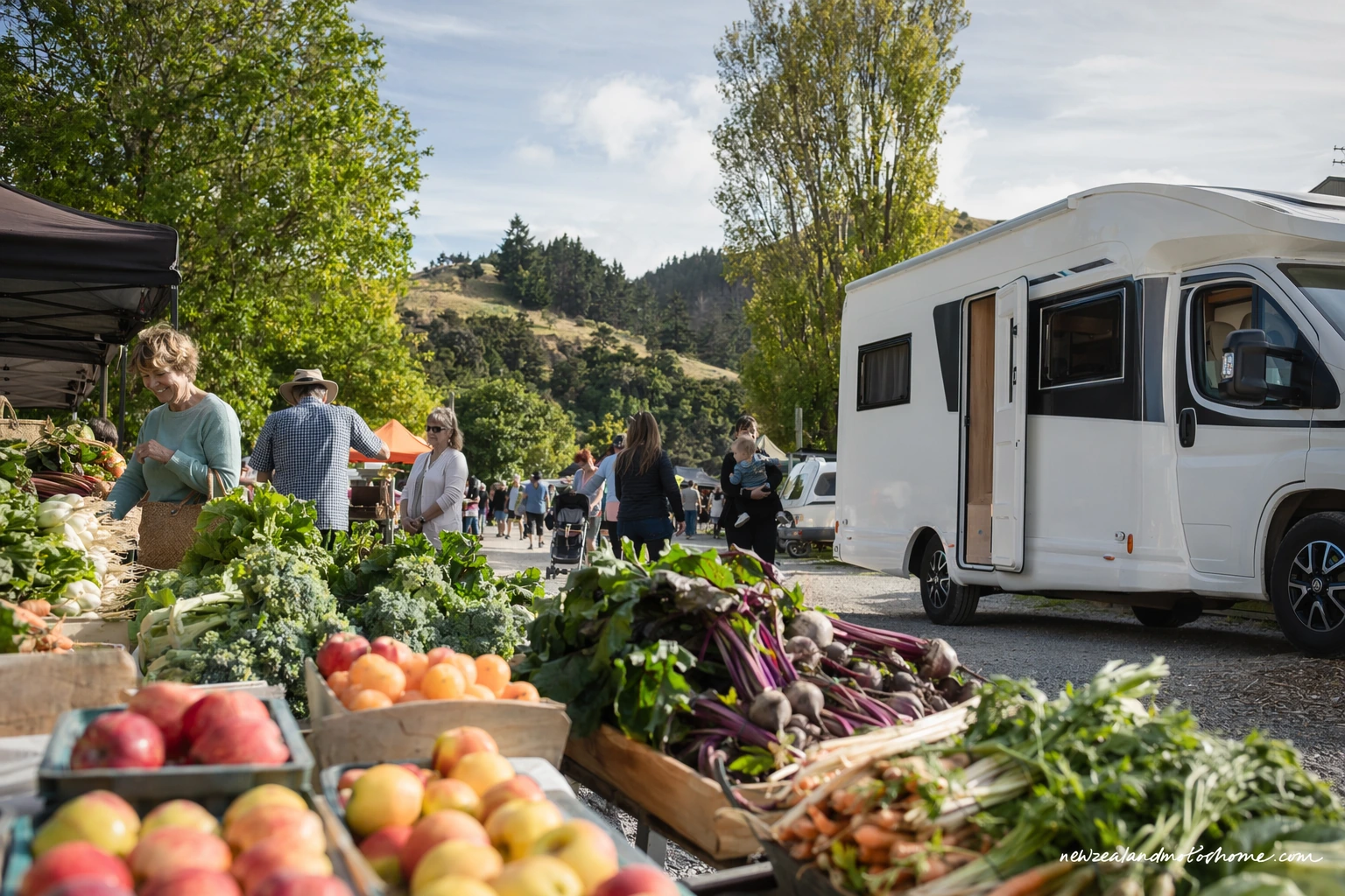 Campervan parked near a Hawke’s Bay farmers market with fresh produce stalls and orchard country nearby
