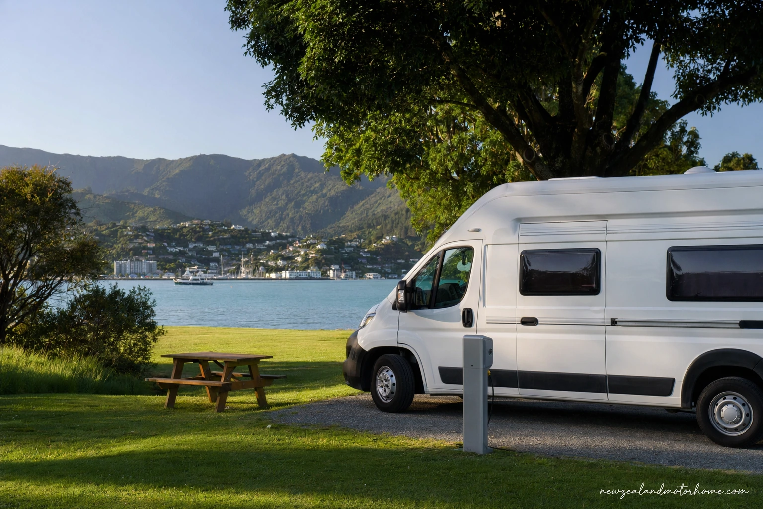 Campervan parked near Picton harbour with the Marlborough Sounds hills in the background