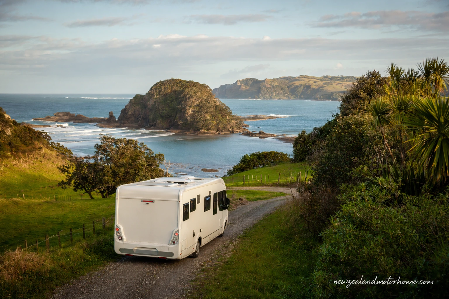Campervan parked near Raglan harbour with west-coast hills and surf beaches nearby