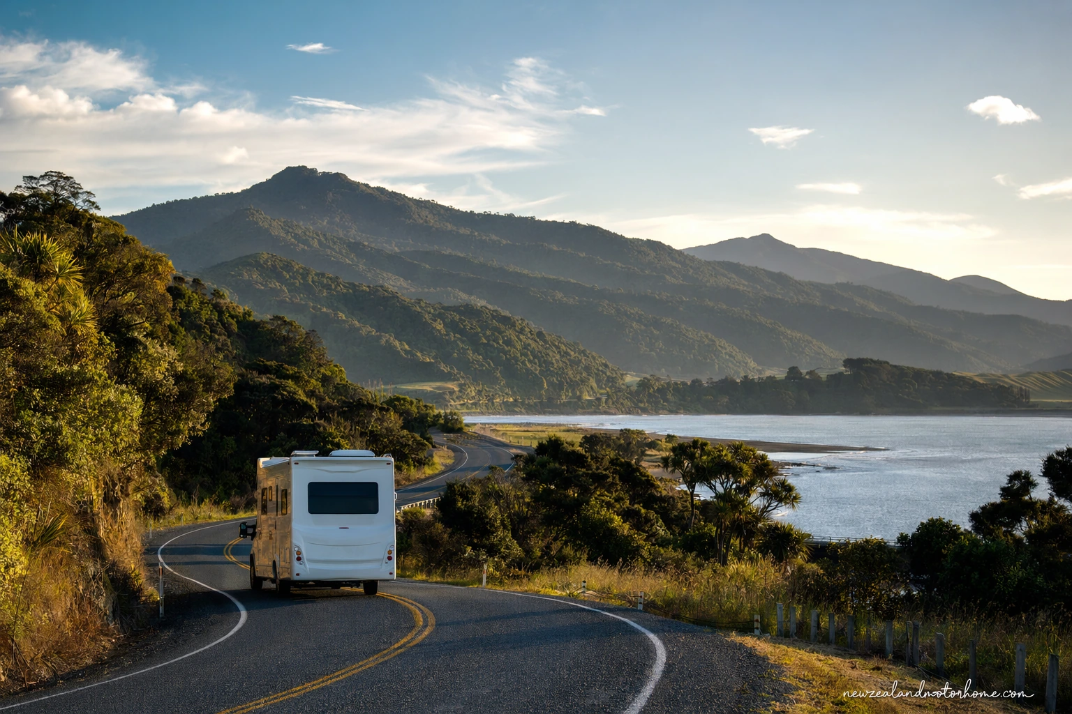 Campervan parked near the New Plymouth coast with Taranaki Maunga in the distance