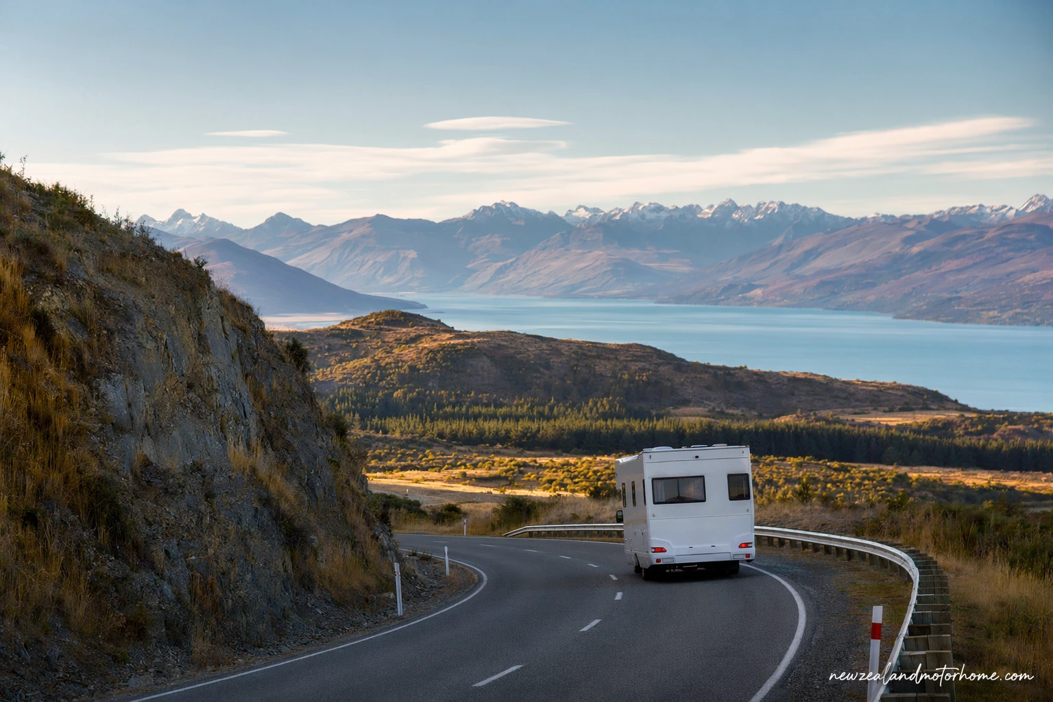 Campervan parked beside a South Island lake on the Queenstown to Nelson route