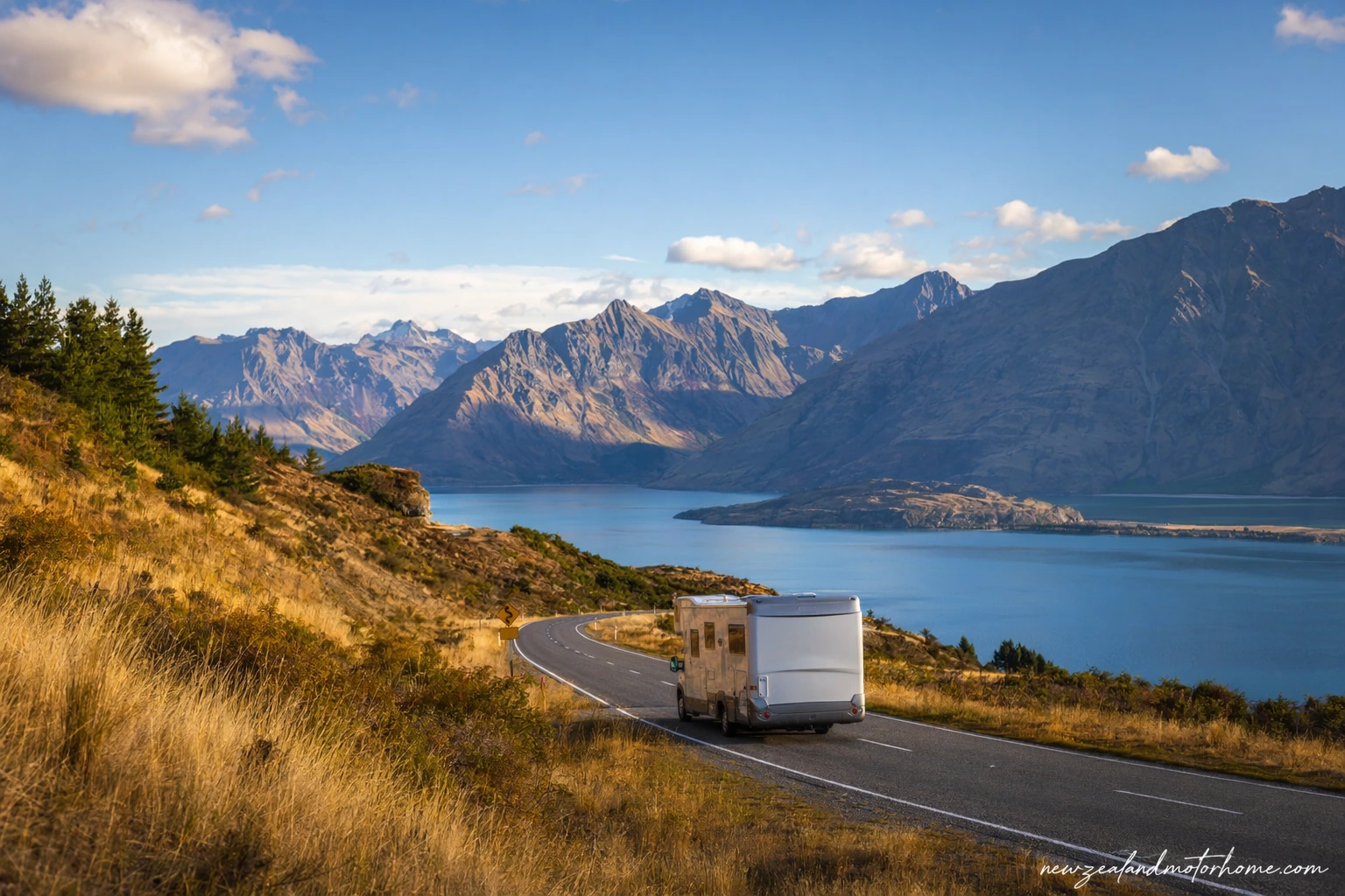 Campervan parked beside Lake Wānaka on the Queenstown to Picton route