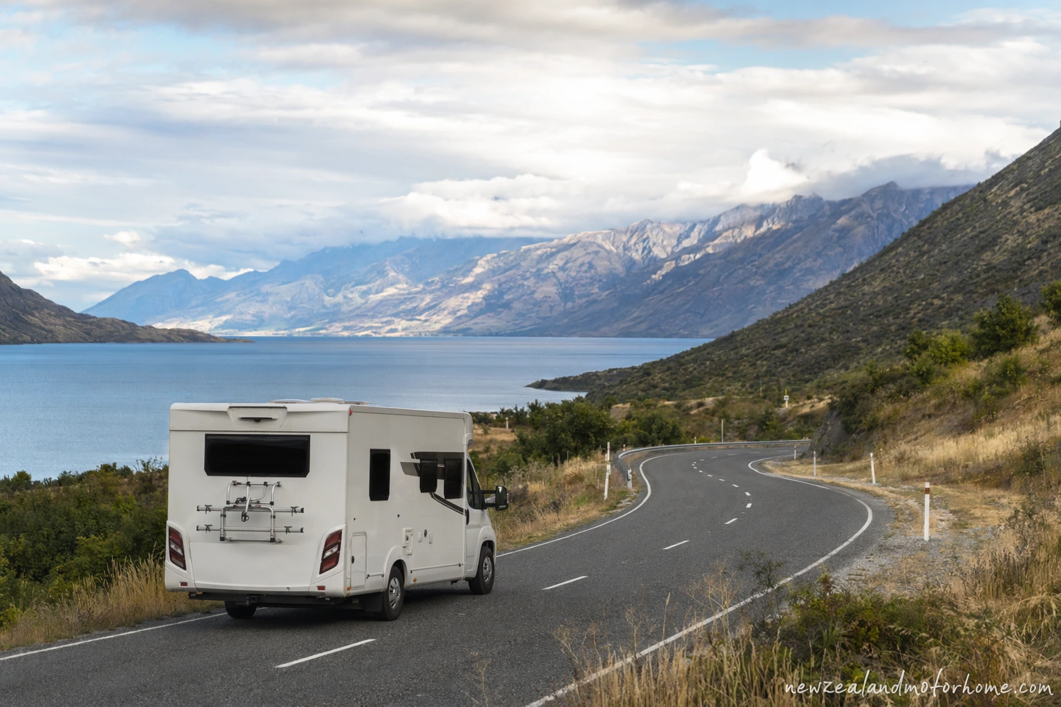 Campervan parked above Lake Wakatipu near Queenstown before the long route north to Tauranga